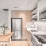 Modern cabinets and open shelving in apartment kitchens at Signal House