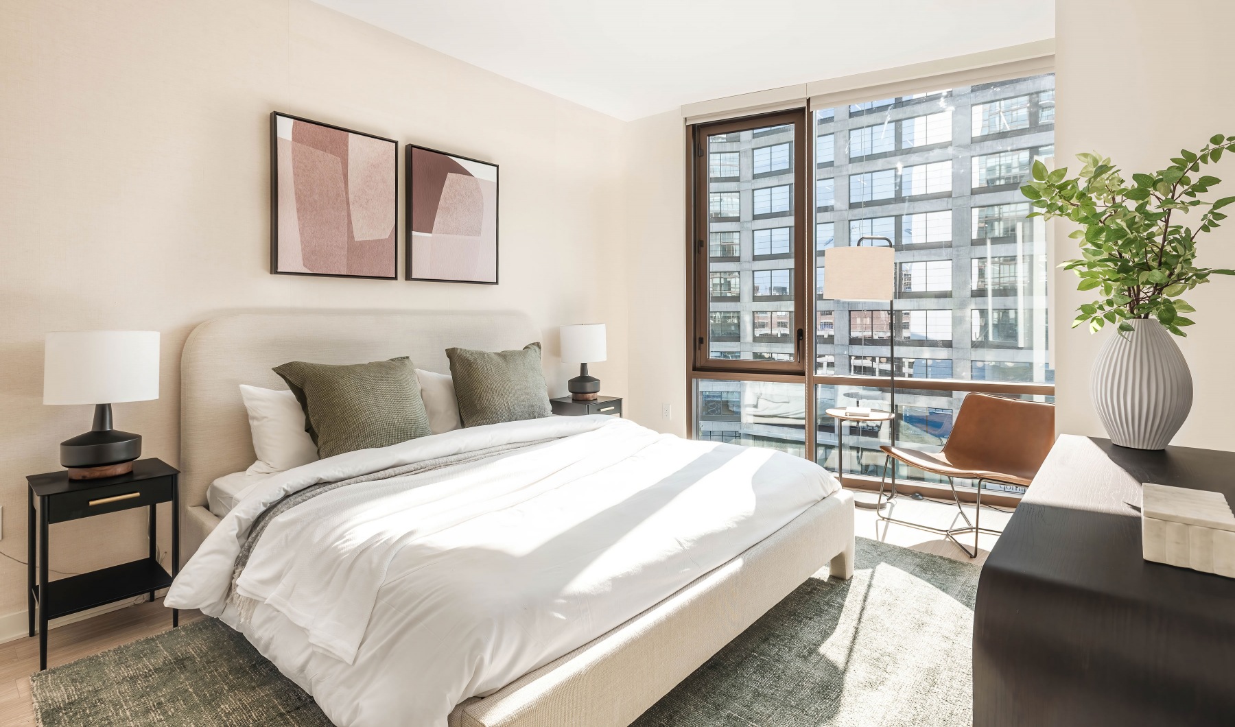 Modern apartment bedroom with large windows at Signal House Modern apartment bedroom with large windows at Signal House