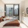 Modern furnished bedroom with floor to ceiling windows at Signal House