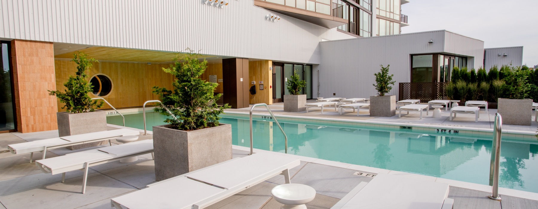 Signal House's community pool with ample seating